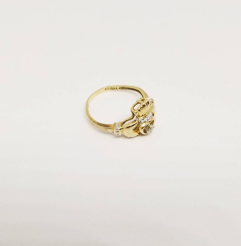 10k TRD Celtic Claddagh ring with solitaire diamond