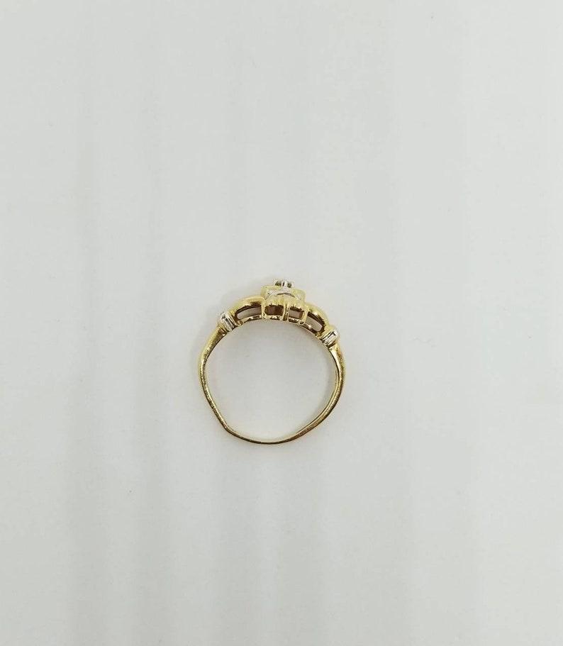 10k TRD Celtic Claddagh ring with solitaire diamond