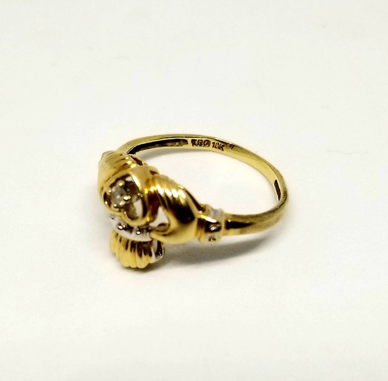 10k TRD Celtic Claddagh ring with solitaire diamond