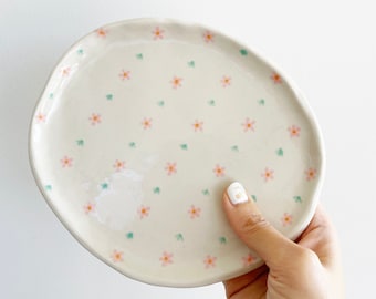 Stoneware ceramic dish with little pink flowers and green leaves