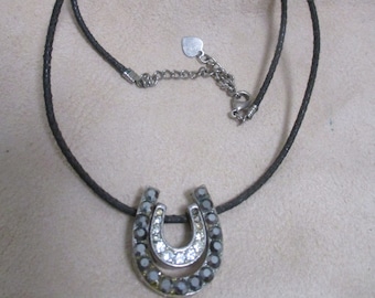 Vintage Double Rhinestoned Horseshoes on 16" choker length cord.  Estate sale item #2118