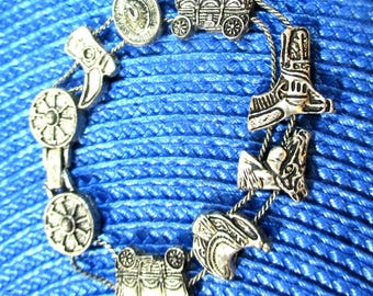 Western Slide Charm Bracelet: Horse Saddle Boots Equestrian, silver-tone, 9 charms, chain link sliders. Vintage # 2254