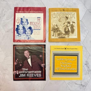 May include: Four Reader's Digest Music Program Notes booklets. Top left: red cover featuring The Andrews Sisters. Top right: yellow cover titled 101 Glorious Melodies From Operetta. Bottom left: black cover featuring Jim Reeves. Bottom right: yellow cover.