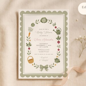 May include: A rectangular baby shower invitation card with a scalloped sage green border. The center features a wreath of garden vegetables, a watering can, and a basket. Text includes Join us for a Baby Shower in honor of Olivia Alexander.