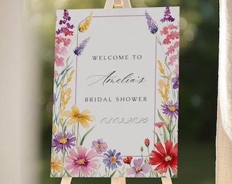 May include: A white bridal shower sign with a floral border. The sign says "Welcome to Amelia's Bridal Shower 03.03.2026".