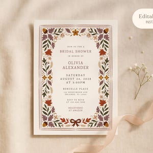 Puede incluir: Una tarjeta de invitación rectangular para una despedida de soltera con un borde decorativo de ilustraciones de temática otoñal que incluyen bellotas, hojas y pequeñas flores en tonos marrón, naranja y morado.