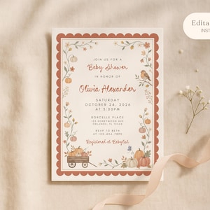 May include: A rectangular baby shower invitation card with a scalloped terracotta border. The design features illustrations of pumpkins, vines, flowers, and a small bird. Text includes Join us for a Baby Shower in honor of Olivia Alexander, date, time, location, and RSVP details.