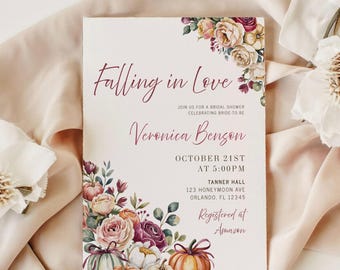 May include: Bridal shower invitation with floral and pumpkin decorations. The invitation says "Falling in Love" and includes the bride's name, date, time, and location. Registered at Amazon.