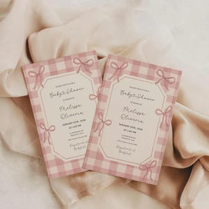 May include: Two baby shower invitations with a pink gingham pattern and bow accents. The invitations include the text "Baby Shower" and the name "Melissa Oliveria". The date is January 13th, 2026.
