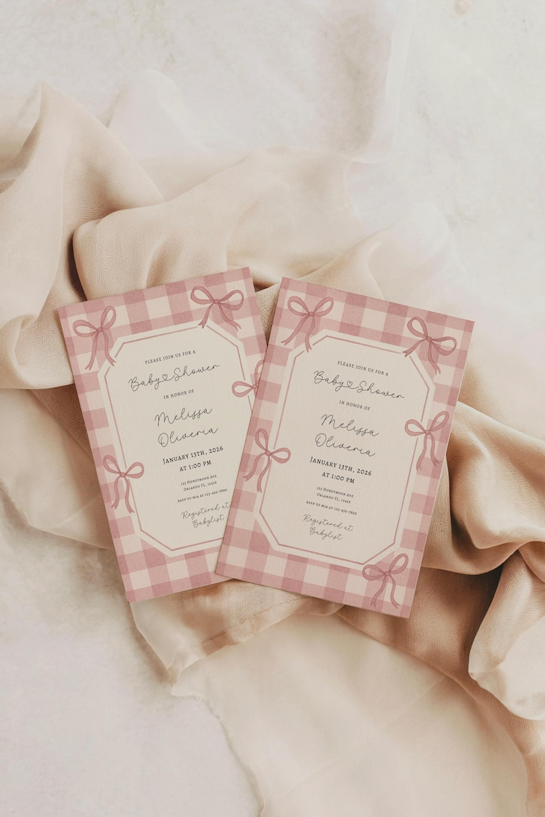 May include: Two baby shower invitations with a pink gingham pattern and bow accents. The invitations include the text "Baby Shower" and the name "Melissa Oliveria". The date is January 13th, 2026.