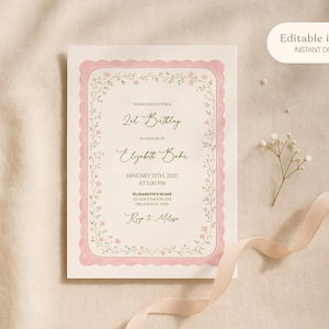 May include: A cream-colored invitation with a pink scalloped border and floral accents. The text reads "2nd Birthday" and includes details for Elizabeth Baker's birthday on January 13th, 2027. A ribbon and flowers are also present.