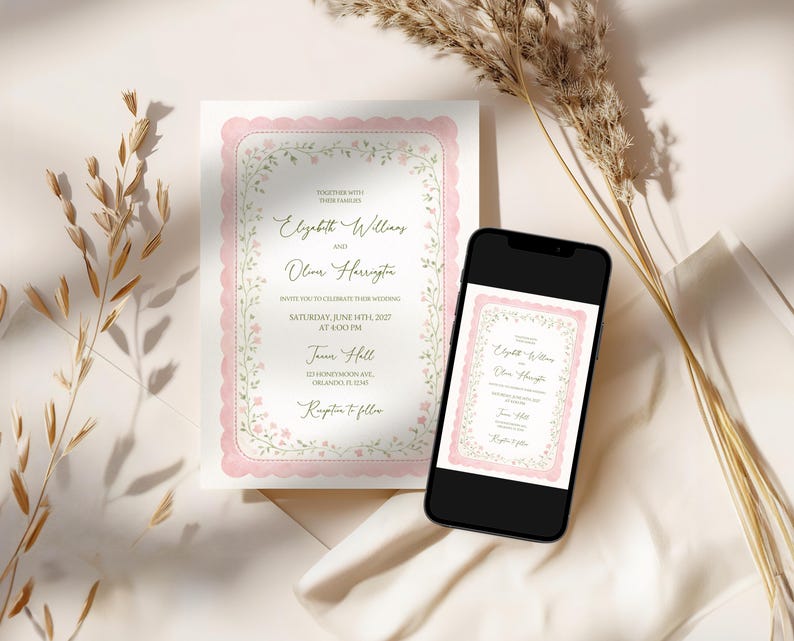 May include: A wedding invitation and a smartphone displaying the same design. The invitation features a pink scalloped border with floral accents and elegant script. The phone screen mirrors the invitation's design, showcasing the event details.