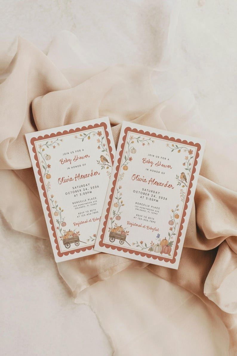 May include: Two rectangular baby shower invitation cards with scalloped rust-colored borders. The white cards feature illustrations of pumpkins, flowers, and a bird, with text reading Join us for a Baby Shower in honor of Olivia Alexander.