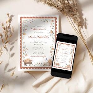 May include: A rectangular baby shower invitation card and a smartphone displaying the same invitation. The design features a scalloped terracotta border, illustrations of pumpkins, flowers, and a bird, with text reading Olivia Alexander.