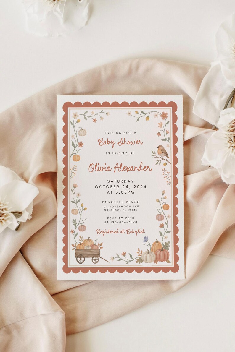 May include: A rectangular baby shower invitation card with a scalloped terracotta border. The design features illustrations of pumpkins, flowers, and a bird. Text includes: Join us for a Baby Shower in honor of Olivia Alexander, Saturday October 24, 2026.