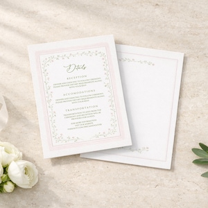 May include: Two white wedding invitation cards with a pink border and floral design. The card on the left has the word "Details" at the top, with text below. A bouquet of white flowers and a white ribbon are on the left.
