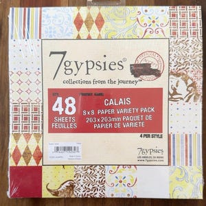 May include: A 7gypsies Calais 8x8 paper variety pack containing 48 sheets. The square package features a central label with the text 7gypsies collections from the journey, 48 sheets, and 8x8 paper variety pack, surrounded by a border of patterned paper.