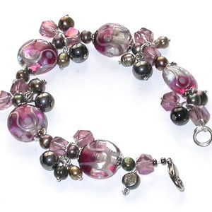 Hand-Made One of a kind Bracelet. Beautiful original bracelet, Lamp work beads, Fresh water pearls and Crystal beads.