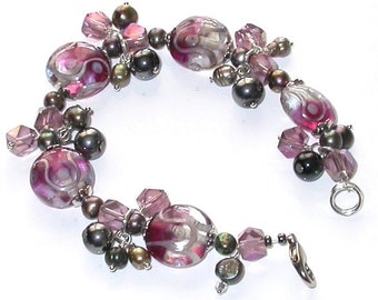 Hand-Made One of a kind Bracelet. Lamp work beads, Fresh water pearls and Crystal beads.
