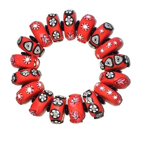 Bracelet. Hand made polymer clay bracelet. Hand made beads Decorated individually with polymer clay cane cured and sanded by hand. From USA