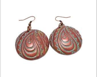 These handmade earrings are made from polymer clay and Covered with a layer of patina to give it a look of imitate rusty copper