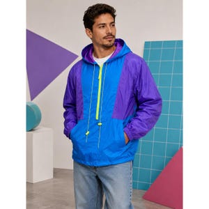 May include: A color-blocked windbreaker jacket featuring a bright blue center panel, purple side panels, and a purple hood lining. The jacket includes a neon yellow front zipper, matching neon yellow drawstring cords, and long sleeves with elastic cuffs.