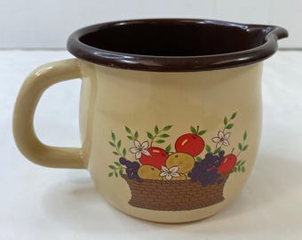 Jarra de crema de metal FTD 1986 con diseño de cesta de frutas, color beige y marrón, estilo vintage.