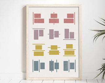 May include: A framed print with a geometric design featuring various shapes in shades of pink, red, yellow, and blue. The shapes are arranged in a grid pattern.