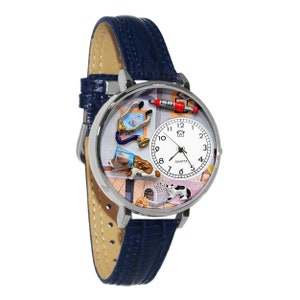May include: A silver-tone quartz watch with a blue leather band. The watch face features a veterinary theme with a stethoscope, syringe, dog, and cat. The watch has a white face with black numerals and hands.