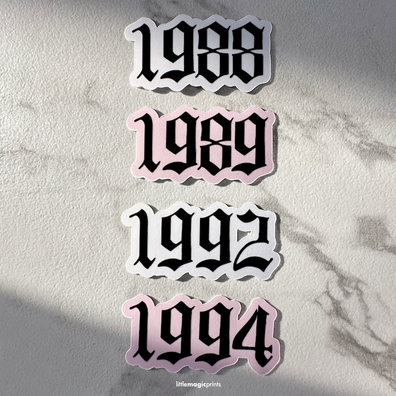 May include: Four stickers with black gothic font numbers on white and pink backgrounds. The numbers are 1988, 1989, 1992, and 1994.