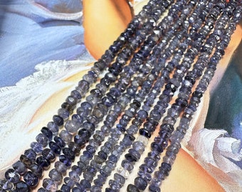 May include: A strand of faceted, dark blue, gemstone beads. The beads are irregular in shape and have a slightly translucent appearance.