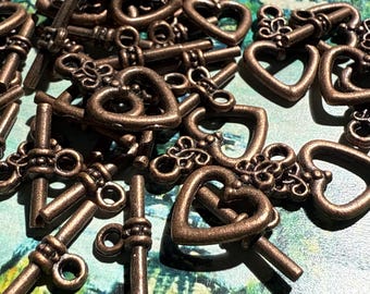 1 x roodkoperen hartvormige kapittelsluiting in antieke stijl met een lengte van 20 mm Sieraden maken - 1 sluiting