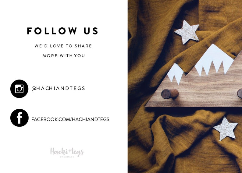 May include: A wooden mountain-shaped coat rack with white painted peaks. The rack has two hooks and is displayed on a brown fabric background. The text "FOLLOW US" is displayed in black text on a white background. The text "WE'D LOVE TO SHARE MORE WITH YOU" is displayed in black text on a white background. The text "@HACHIANDTEGS" is displayed in black text on a white background. The text "FACEBOOK.COM/HACHIANDTEGS" is displayed in black text on a white background. The text "Hachi+tegs HANDMADE" is displayed in gray text on a white background.