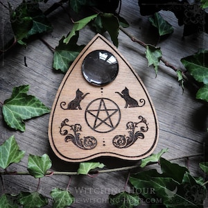 Wooden ouija planchette with cats and a pentagram, spiritualism tool or cabinet of curiosities decor