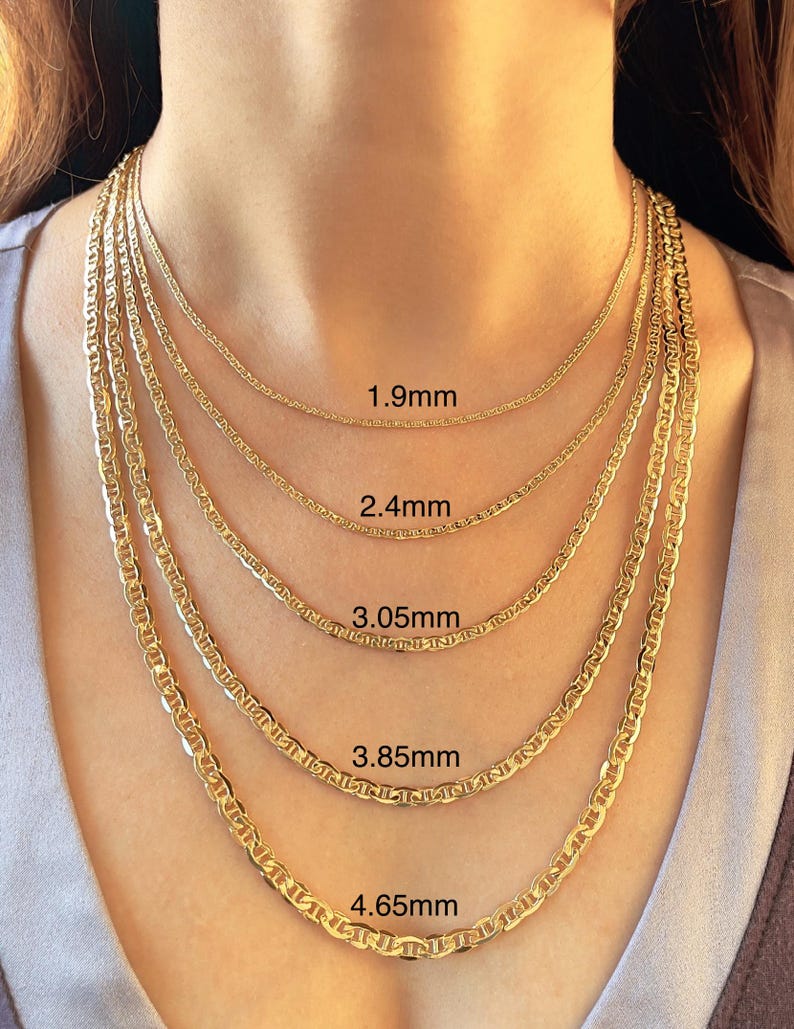 10k 14k real gold flat mariner anchor link chain necklace for men and women shown on a model wearing layered yellow gold chains in different widths. Chain size comparison includes 1.9mm 2.4 mm, 3.05 mm, 3.85 mm, and 4.65 mm flat mariner link chains. Classic unisex gold necklace style with polished anchor links, perfect for layering or everyday wear.