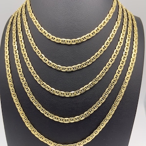 14k yellow real gold flat mariner chain necklace. Sturdy 4.65mm yellow gold anchor link chain displayed in five sizes: 16 inch sits at the collarbone, 18 inch below the collarbone, 20 inch at upper chest, 22 inch at mid chest, and 24 inch longer layered style. Minimal 14k gold jewelry for men and women.