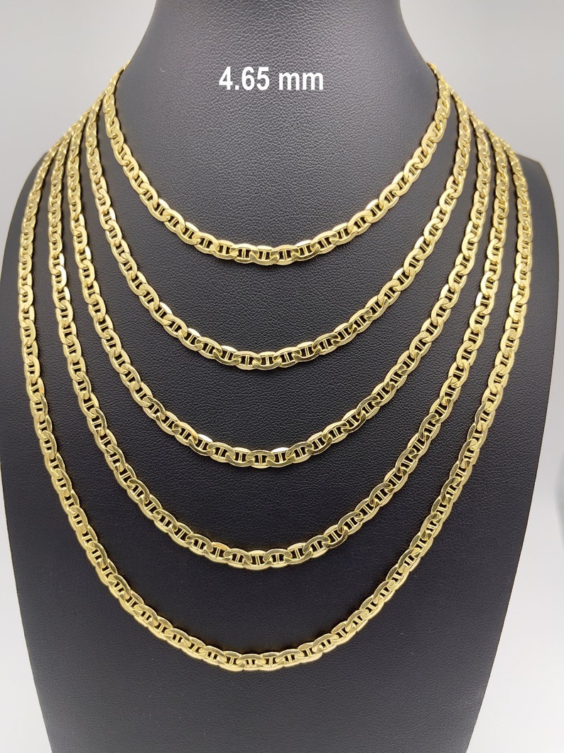 14k yellow real gold flat mariner chain necklace. Sturdy 4.65mm yellow gold anchor link chain displayed in five sizes: 16 inch sits at the collarbone, 18 inch below the collarbone, 20 inch at upper chest, 22 inch at mid chest, and 24 inch longer layered style. Minimal 14k gold jewelry for men and women.