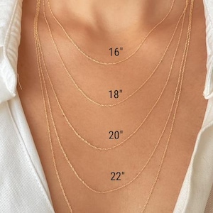 Five 14k yellow solid gold twisted rope chains of different lengths, 16 inches, 18 inches, 20 inches, 22 inches, and 24 inches, are layered on a model's neck. The chains are all the same width, 0.8mm.