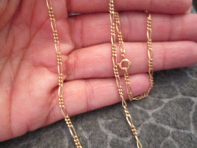 Beautiful 12kt 24 long designer chain very pretty Looks amazingly like 14kt.!! Figaro style