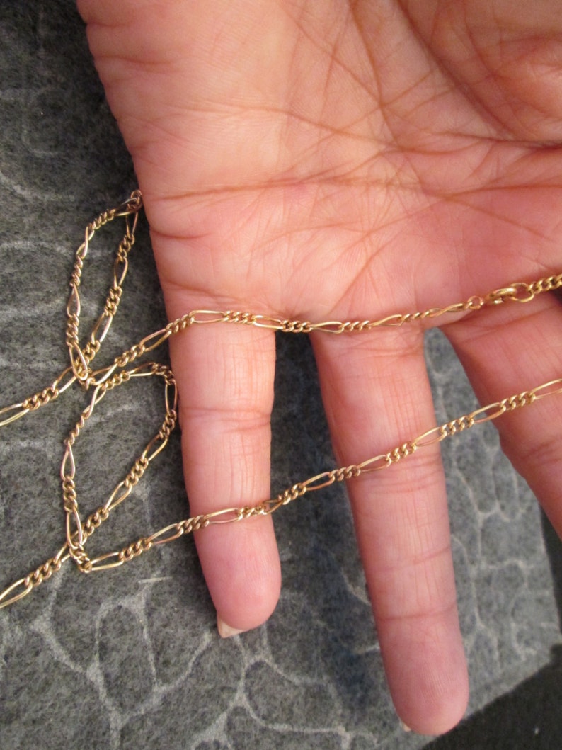 Beautiful 12kt 24 long designer chain very pretty Looks amazingly like 14kt.!! Figaro style