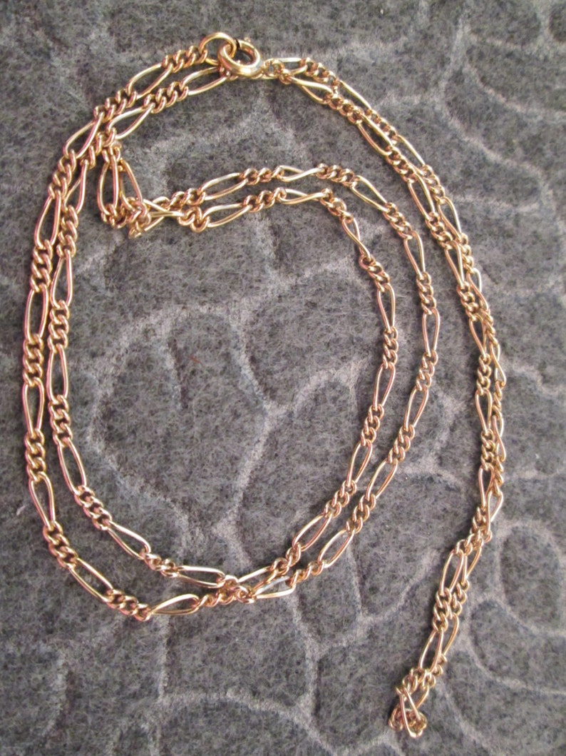 Beautiful 12kt 24 long designer chain very pretty Looks amazingly like 14kt.!! Figaro style