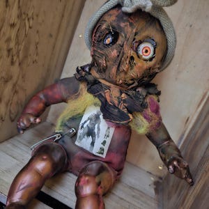 Scarecrow pumpkin head horror Artia baby doll art horror decor