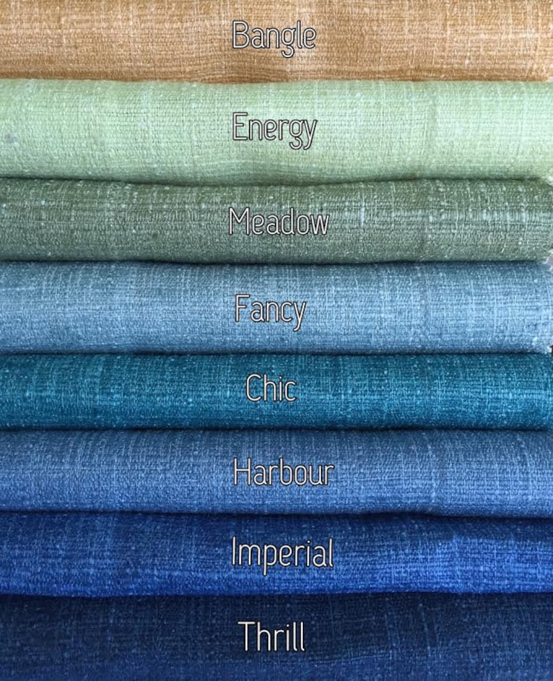 May include: A stack of eight fabric swatches in various shades of blue, green, and brown. The swatches are labeled with the names "Bangle", "Energy", "Meadow", "Fancy", "Chic", "Harbour", "Imperial", and "Thrill".