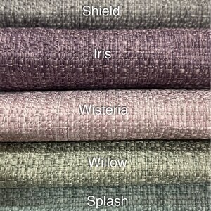 May include: Five fabric swatches in different shades of purple, pink, and gray. The swatches are labeled "Shield", "Iris", "Wisteria", "Willow", and "Splash".