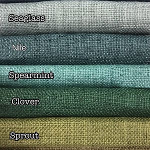 May include: Seven fabric swatches in different shades of green and blue. The swatches are labeled from top to bottom: Pool, Seaglass, Nile, Spearmint, Clover, Sprout, and Tarragon.