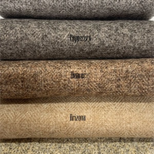 May include: Five fabric swatches in a herringbone pattern. The swatches are stacked on top of each other. The swatches are labelled from top to bottom: Chrome, Peppercorn, Beaver, Arizona, and Granite.