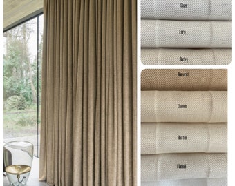May include: A close-up of a set of fabric swatches in various shades of beige and brown. The swatches are labeled with names like "Dolphin", "Dove", "Ecru", "Barley", "Harvest", "Chamois", "Butter", "Flannel", and "Mochaster".