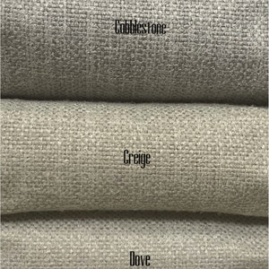 May include: Five fabric swatches in different shades of gray, from dark to light. The swatches are labeled "Ash", "Cobblestone", "Creige", "Dove", and "Frost".