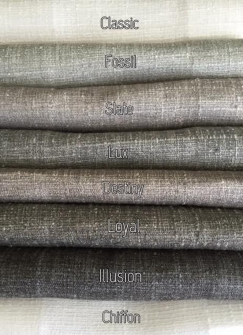 May include: Close-up of eight fabric swatches in various shades of gray, from light to dark. The swatches are labeled with the names "Classic", "Fossil", "Slate", "Lux", "Destiny", "Loyal", "Illusion", and "Chiffon".