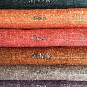 May include: Six different fabric swatches in various colors and textures. The swatches are labeled from top to bottom: Super Nova, Bloom, Bravo, Vintage, Cabana, and Twist.